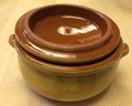 Rustic brown yellow pottery dish or cocotte with lid. Farmhouse charm
