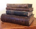 Four antique decorative books sold as a set
