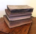 Four antique decorative books sold as a set