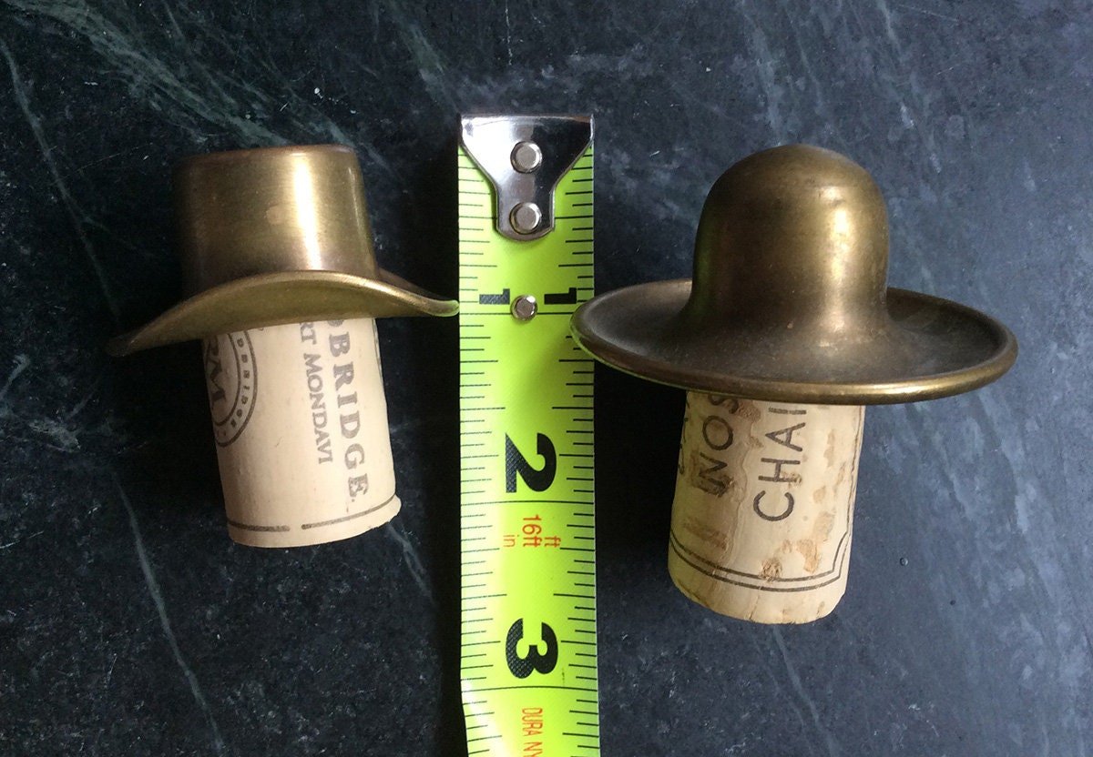 Vintage brass bottle toppers shaped as hats