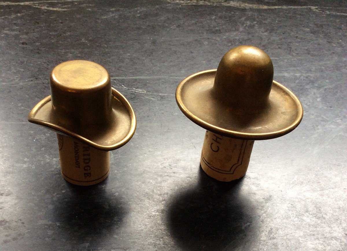 Vintage brass bottle toppers shaped as hats