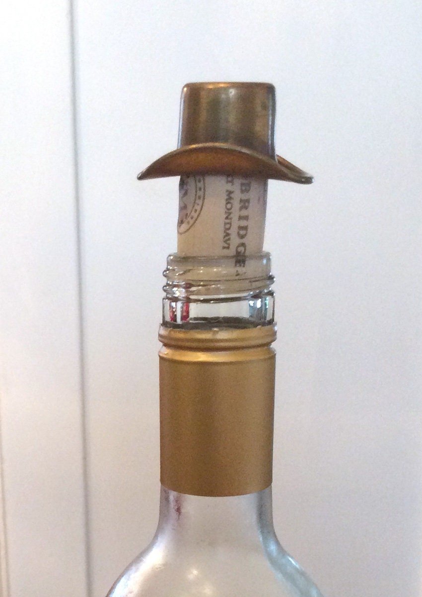 Vintage brass bottle toppers shaped as hats