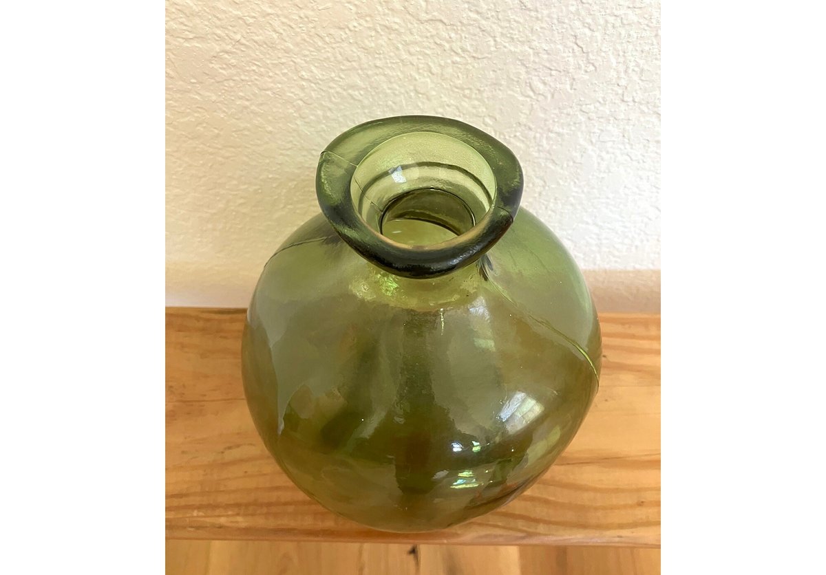 Green glass bottle vase