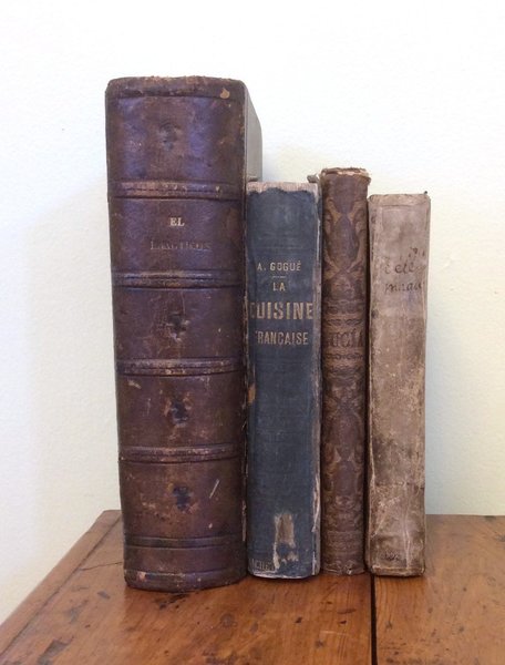 Four antique decorative books sold as a set